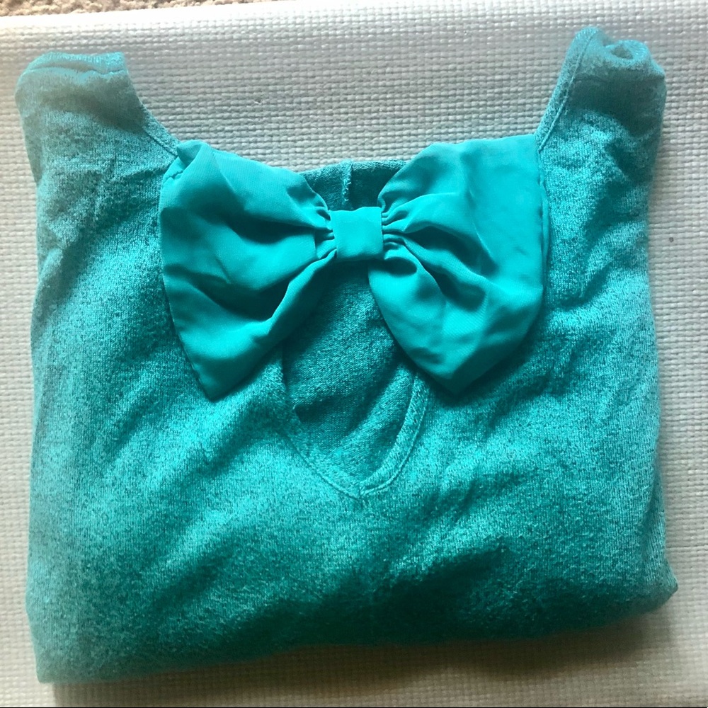 TEMPTED brand teal top with bow on back; Large